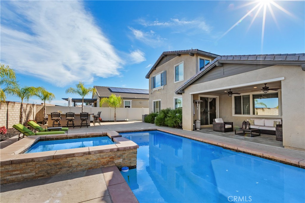 24128 Deputy Way Menifee, CA 92584 - Photo 34 of 34 a view of a house with swimming pool and sitting area