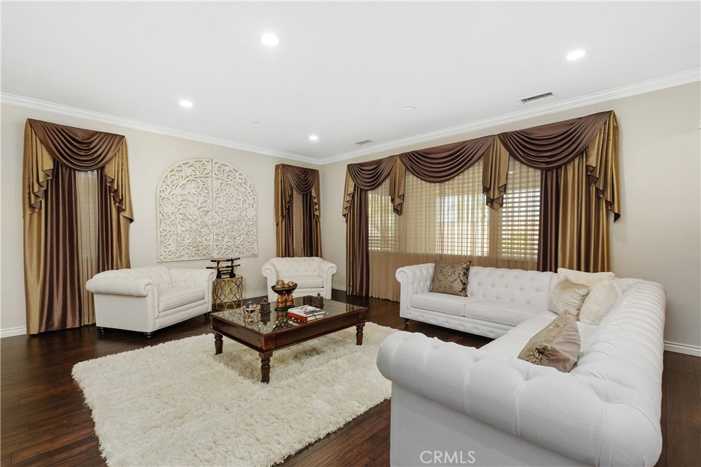 24128 Deputy Way Menifee, CA 92584 - Photo 5 of 34 a living room with furniture and a potted plant