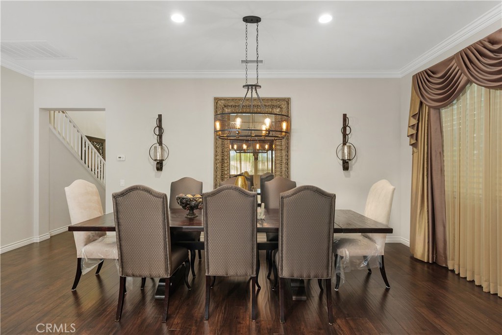 24128 Deputy Way Menifee, CA 92584 - Photo 6 of 34 a view of a dining room with furniture window and wooden floor