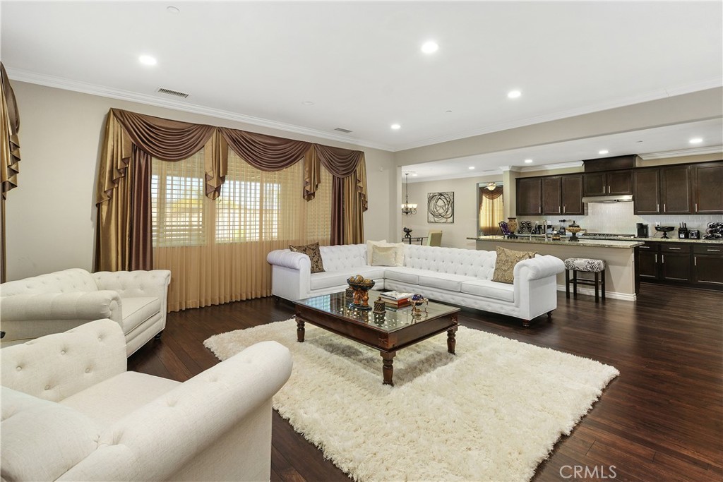 24128 Deputy Way Menifee, CA 92584 - Photo 7 of 34 a living room with furniture or couch and a wooden floor