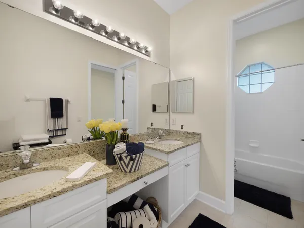a living room with furniture a window and a chandelier