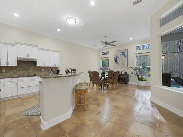 a view of a dining room with furniture window and outside view