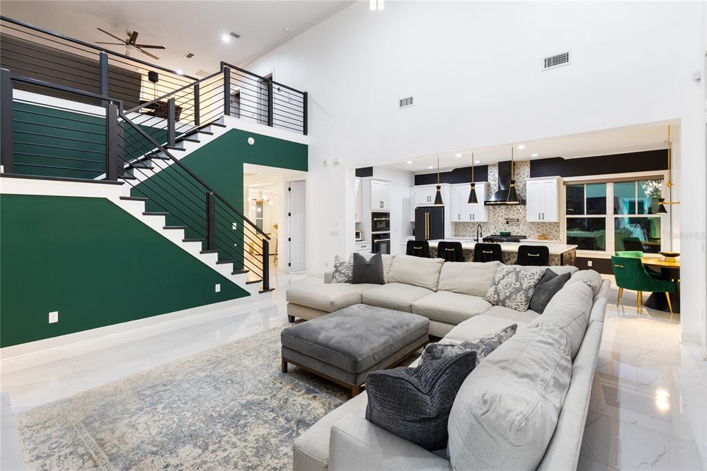 12664 Banting Terrace Orlando, FL 32827 - Photo 15 of 79 a living room with furniture and a fireplace