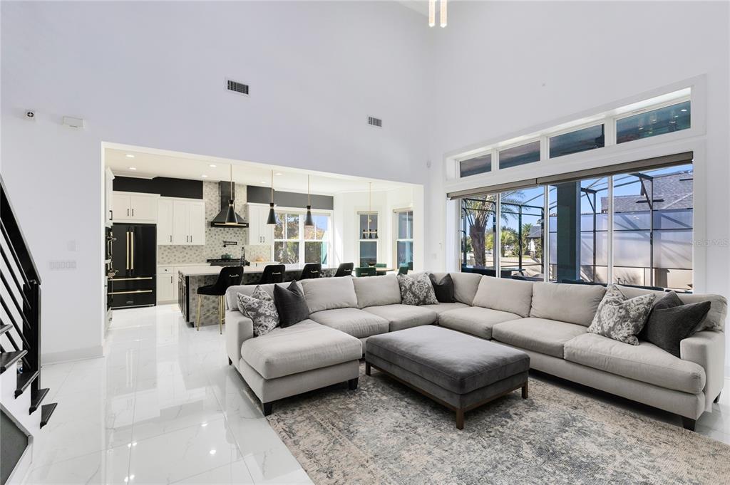 12664 Banting Terrace Orlando, FL 32827 - Photo 16 of 79 a living room with furniture and a large window