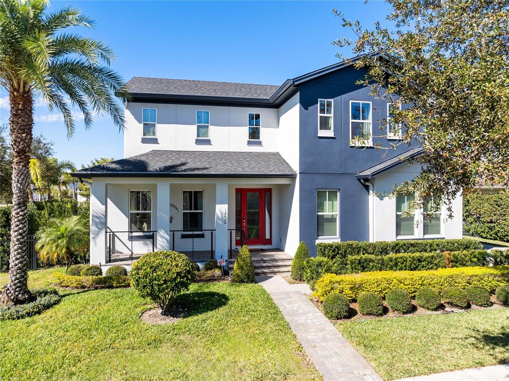 12664 Banting Terrace Orlando, FL 32827 - Photo 2 of 79 a front view of a house with a yard