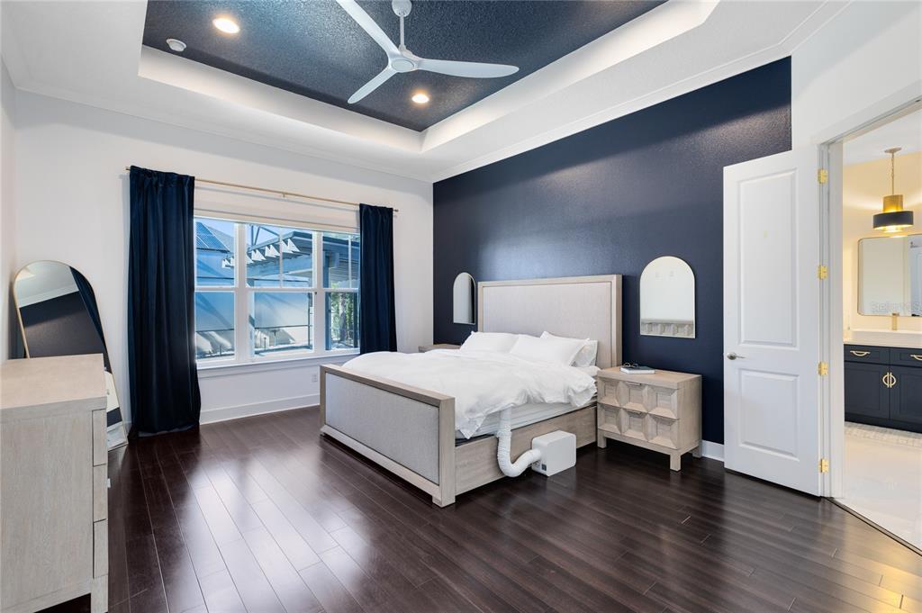 12664 Banting Terrace Orlando, FL 32827 - Photo 23 of 79 a bedroom with a large bed and a large window