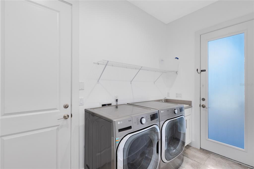 12664 Banting Terrace Orlando, FL 32827 - Photo 28 of 79 a utility room with dryer and washer