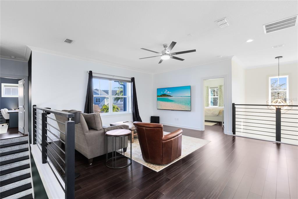 12664 Banting Terrace Orlando, FL 32827 - Photo 30 of 79 a living room with furniture and a window