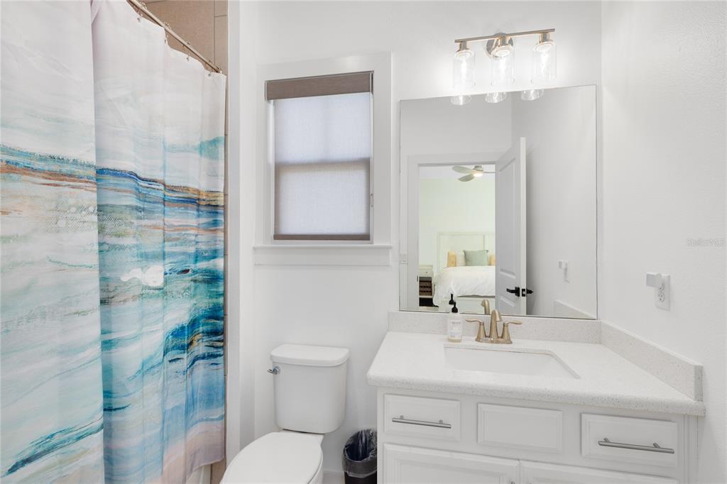 12664 Banting Terrace Orlando, FL 32827 - Photo 38 of 79 a bathroom with a sink a toilet and shower