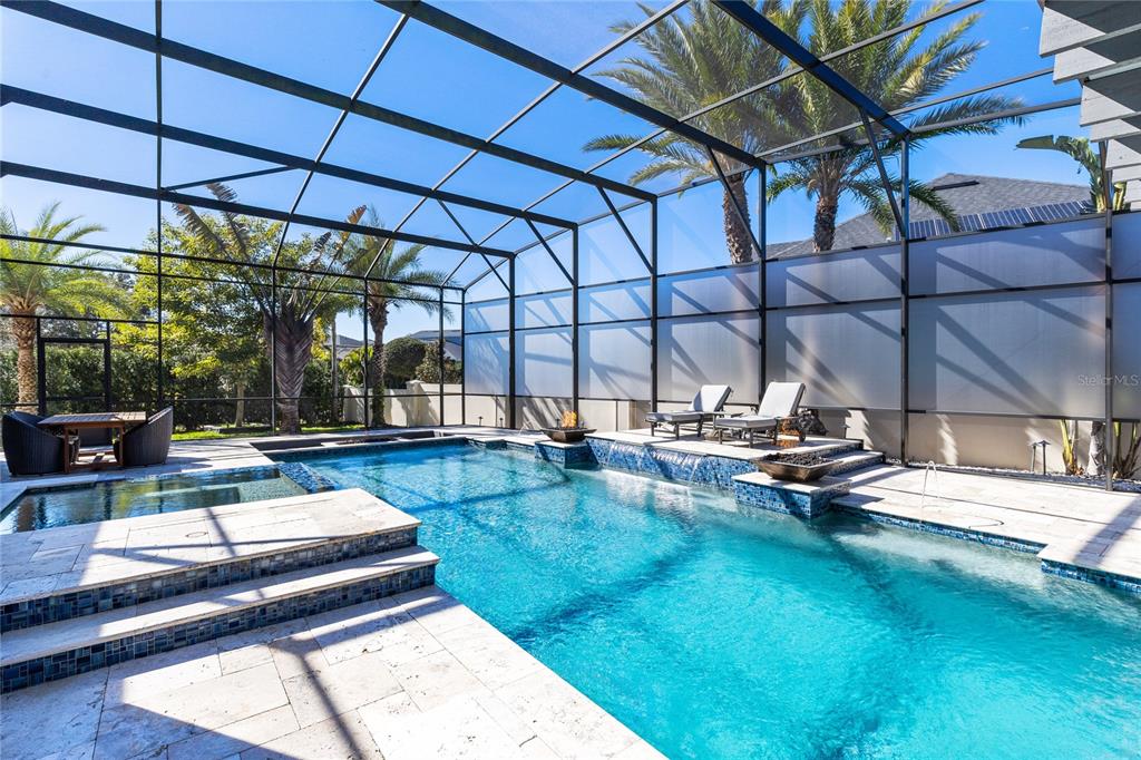 12664 Banting Terrace Orlando, FL 32827 - Photo 47 of 79 a view of a swimming pool with a patio