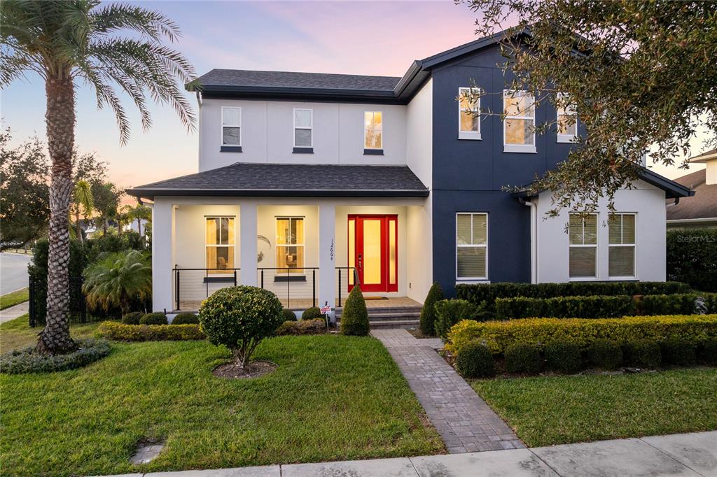 12664 Banting Terrace Orlando, FL 32827 - Photo 56 of 79 a front view of a house with a yard