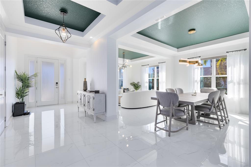 12664 Banting Terrace Orlando, FL 32827 - Photo 6 of 79 a living room with furniture a dining table and a potted plant