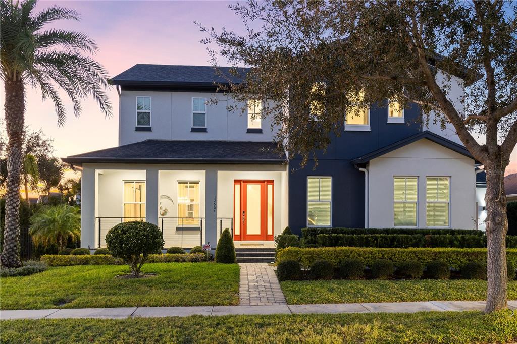 12664 Banting Terrace Orlando, FL 32827 - Photo 64 of 79 a front view of a house with garden