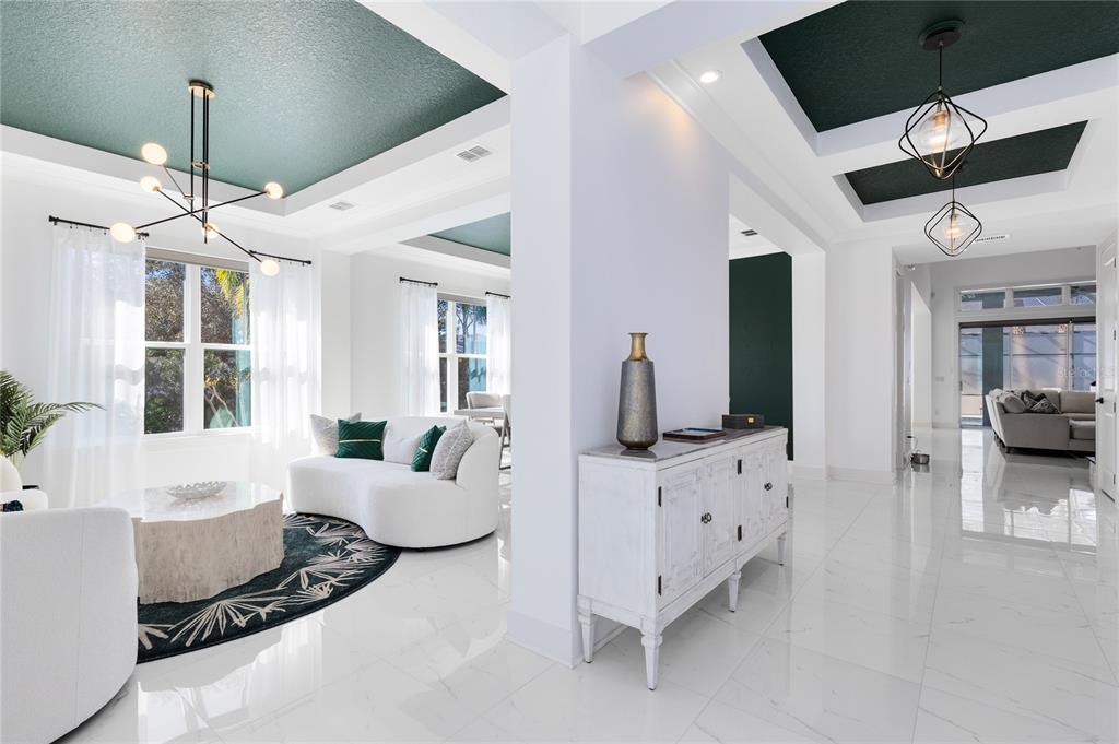 12664 Banting Terrace Orlando, FL 32827 - Photo 7 of 79 a living room with furniture and a flat screen tv