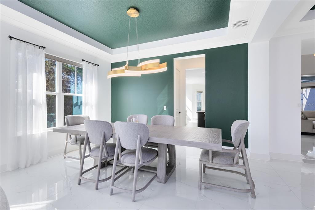 12664 Banting Terrace Orlando, FL 32827 - Photo 9 of 79 a view of a dining room with furniture and a window