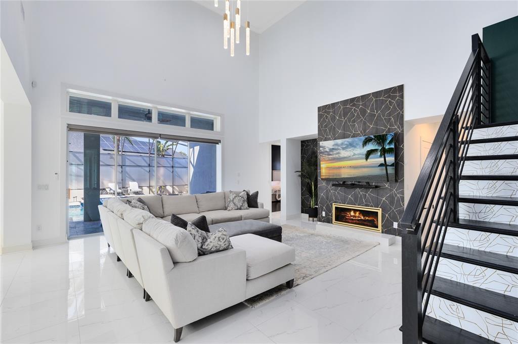 12664 Banting Terrace Orlando, FL 32827 - Photo 10 of 79 a living room with furniture and a fireplace