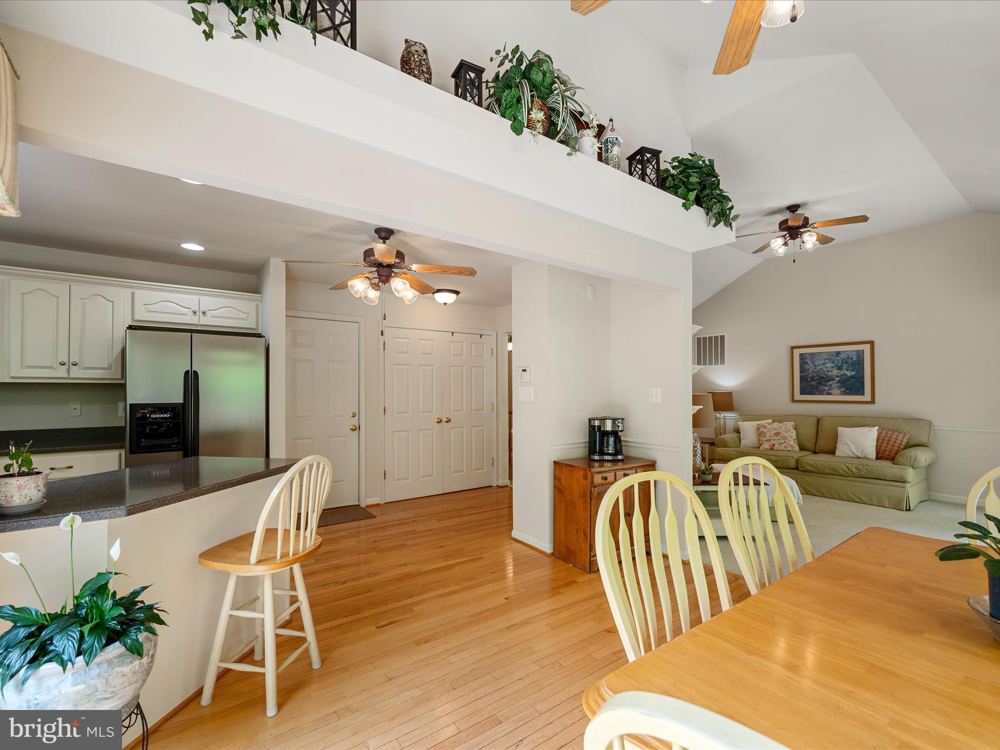 108 Eagle Drive Cross Junction, VA 22625 - Photo 14 of 61 a living room with furniture a wooden floor and potted plants