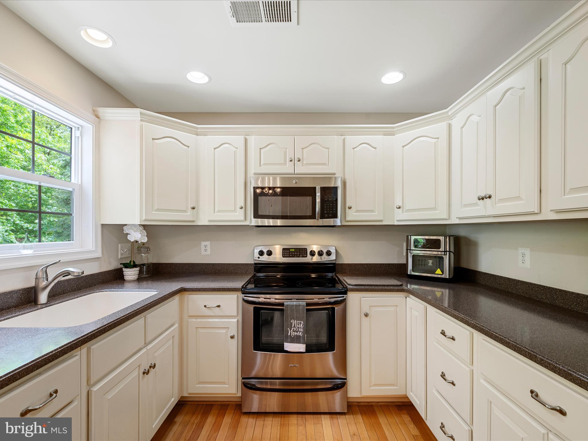 108 Eagle Drive Cross Junction, VA 22625 - Photo 16 of 61 a kitchen with stainless steel appliances granite countertop white cabinets and a stove a sink