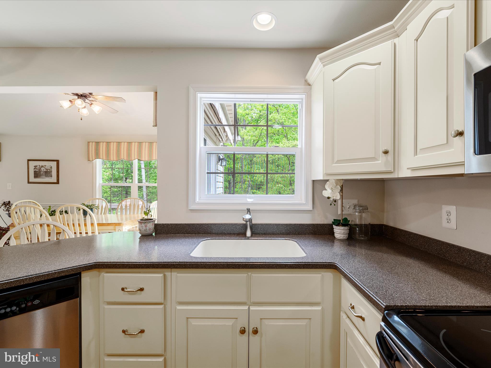 108 Eagle Drive Cross Junction, VA 22625 - Photo 17 of 61 a kitchen with granite countertop a sink white cabinets and window