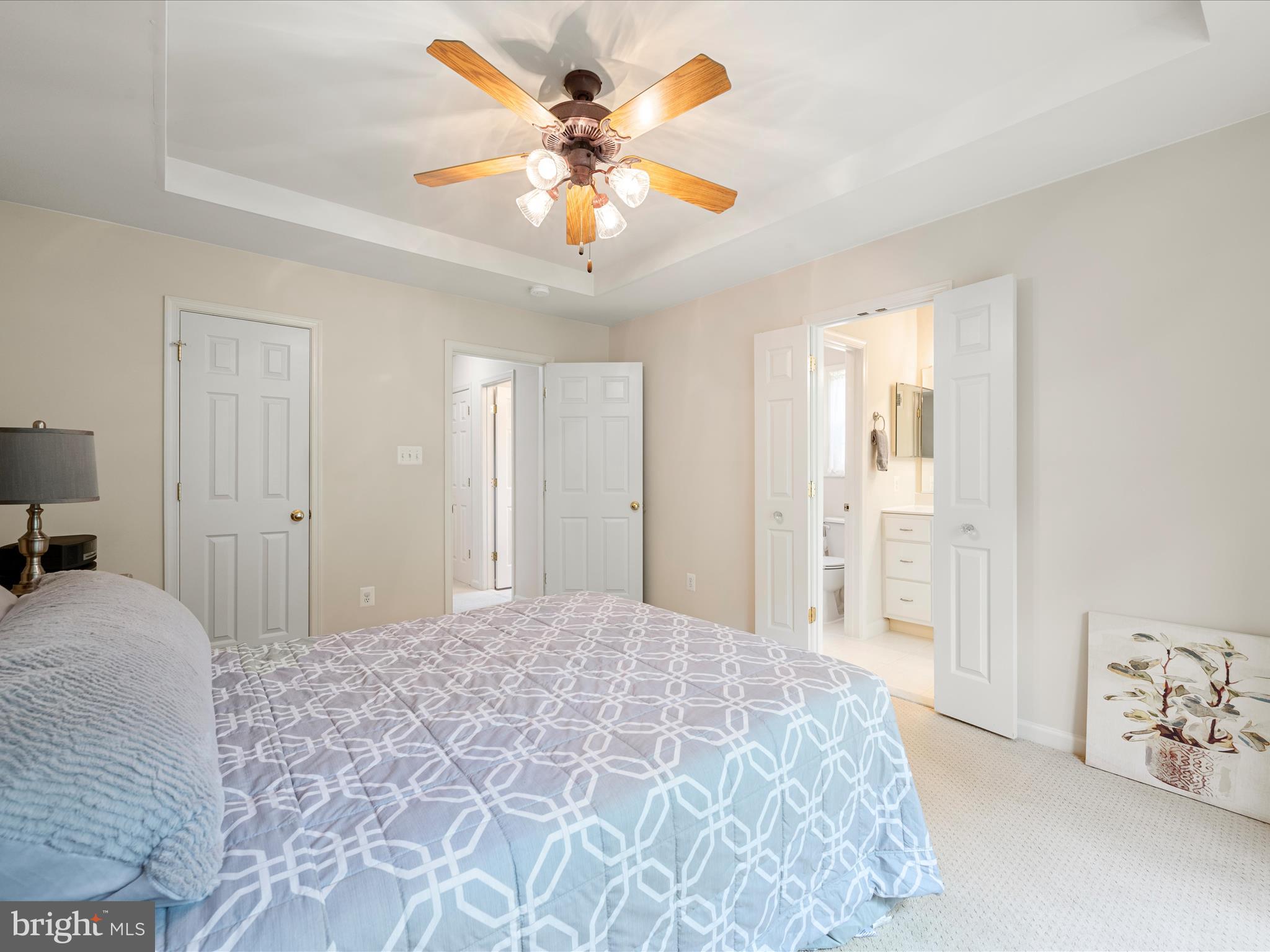 108 Eagle Drive Cross Junction, VA 22625 - Photo 20 of 61 a bedroom with a large bed and a chandelier