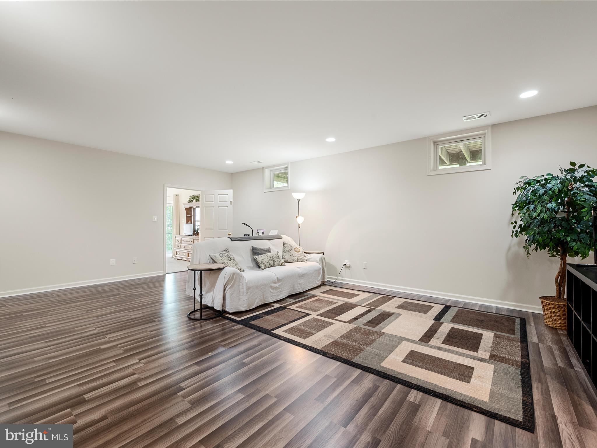 108 Eagle Drive Cross Junction, VA 22625 - Photo 29 of 61 a living room with couch and a potted plant