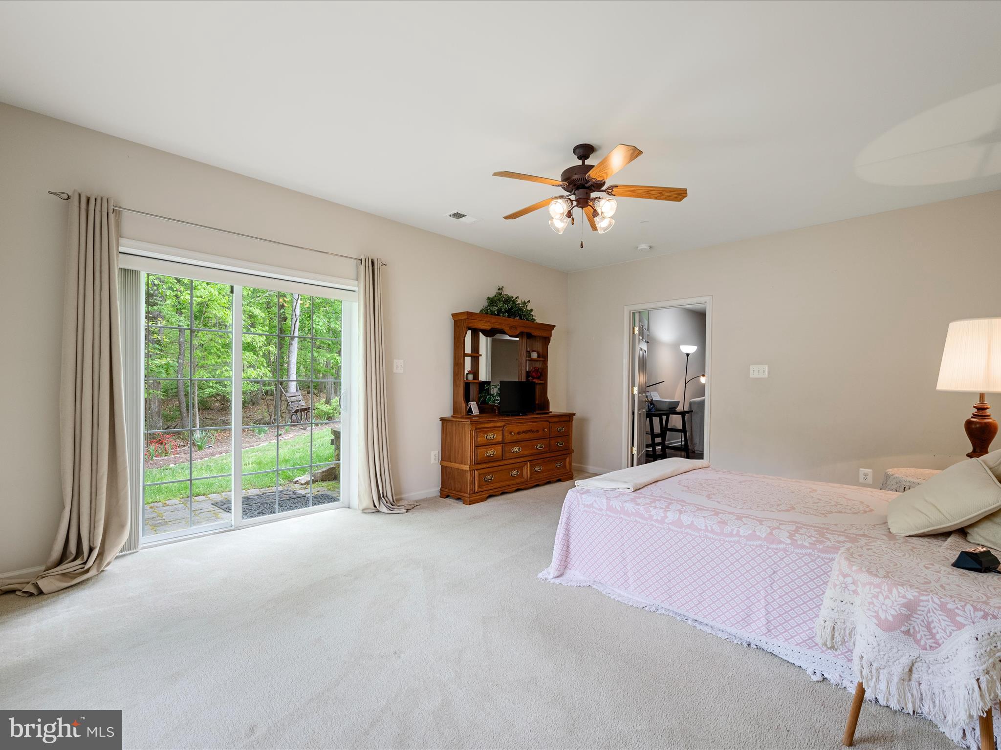 108 Eagle Drive Cross Junction, VA 22625 - Photo 31 of 61 a bedroom with a large bed and a chandelier