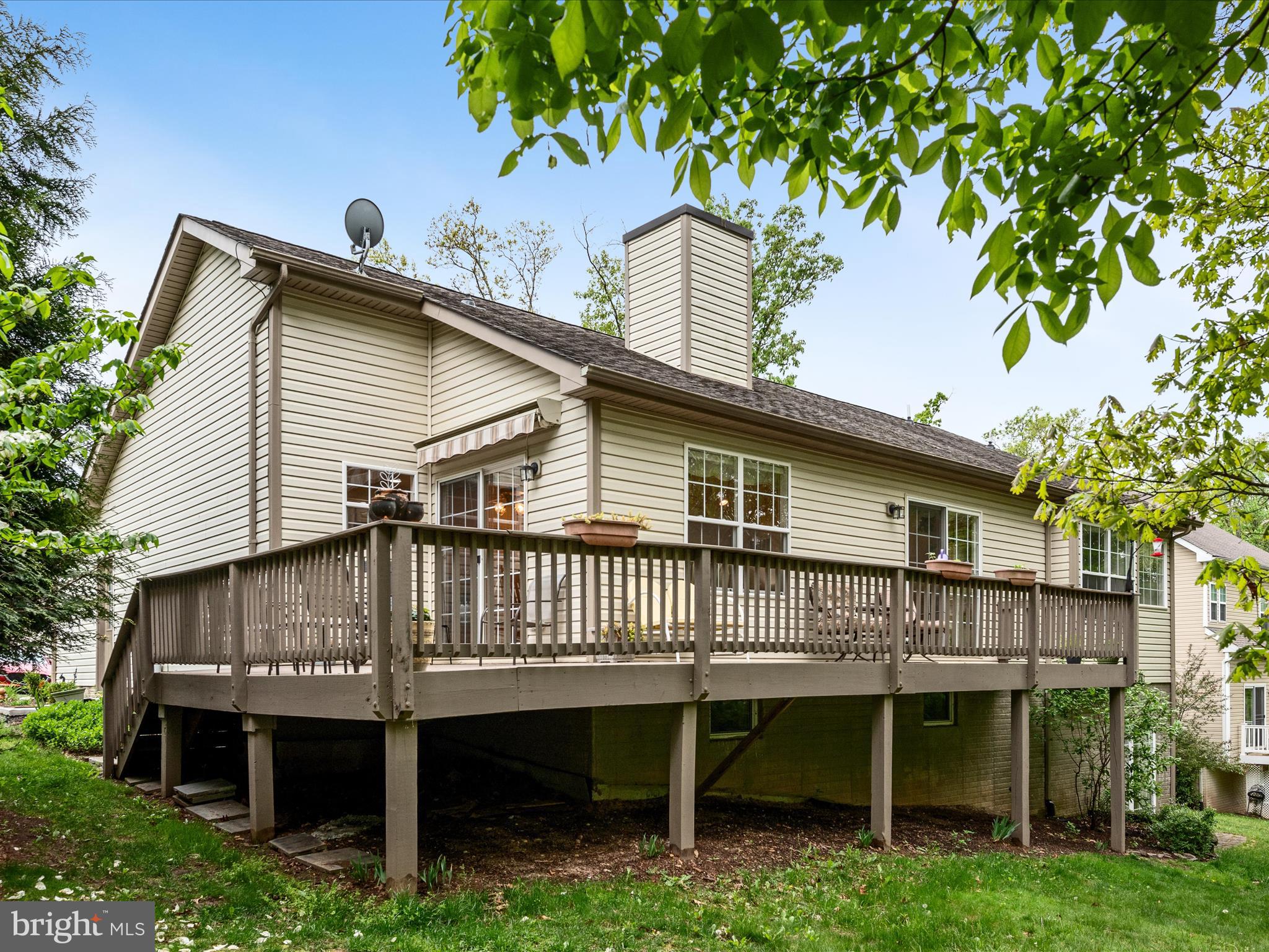 108 Eagle Drive Cross Junction, VA 22625 - Photo 39 of 61 a view of a house with a deck and a backyard