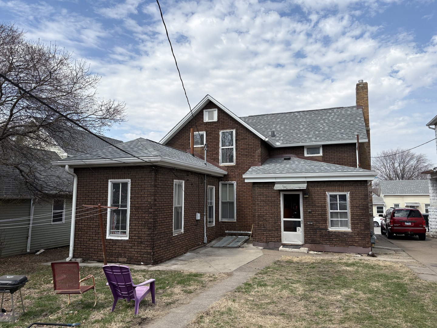 2428 5th Avenue Moline, IL 61265 - Photo 4 of 5 a front view of a house with a yard