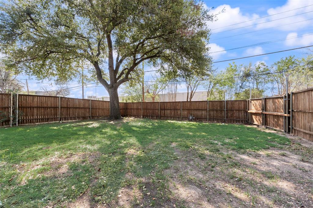 3106 Sharpview Lane Dallas, TX 75228 - Photo 32 of 33 a view of backyard with wooden fence and large trees