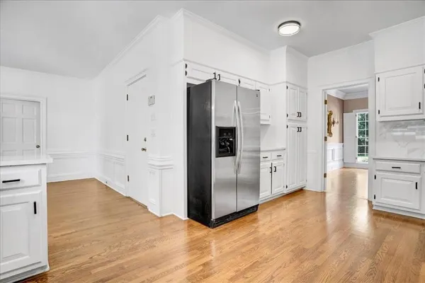 a spacious bedroom with a bed and a large window