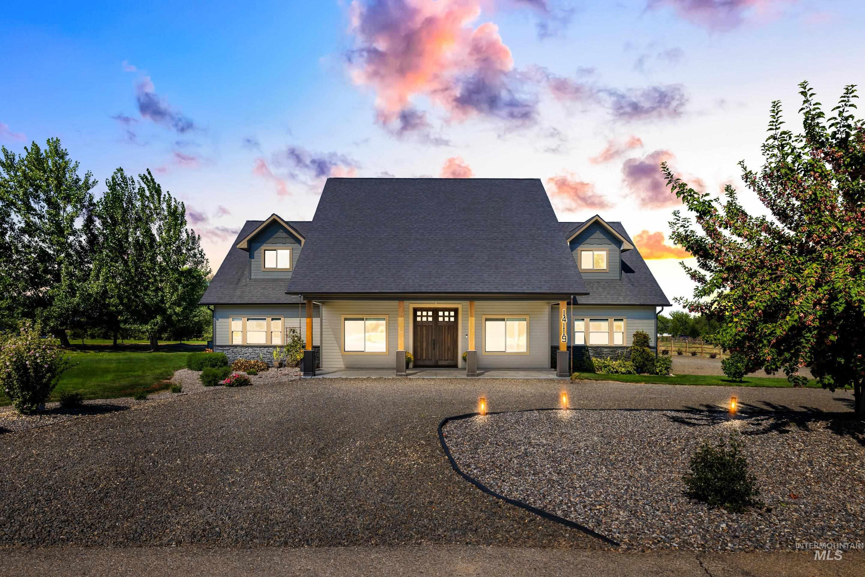 Cape cod home featuring a porch