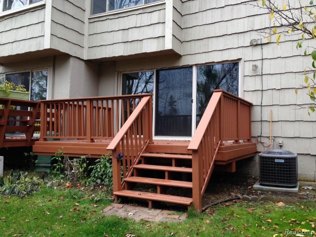 616 Rickett Road, Unit 109 Brighton, MI 48116 - Photo 6 of 38 Back Deck.jpg