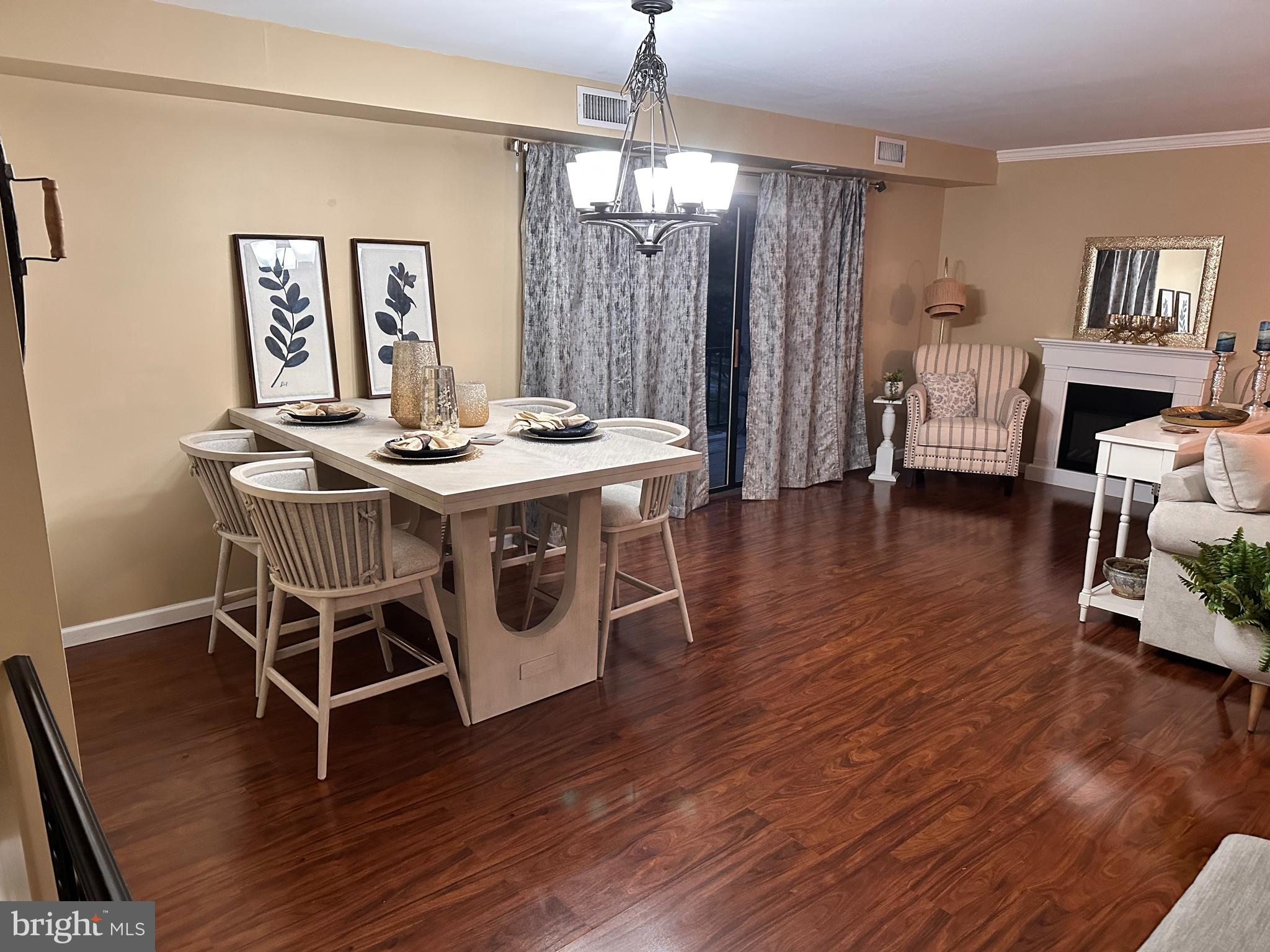 314 Valleybrook Drive Lancaster, PA 17601 - Photo 3 of 19 a view of a dining room with furniture wooden floor and a chandelier