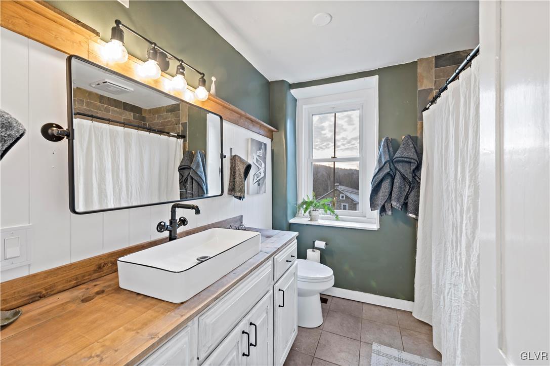90 Crow Hill Road Barto, PA 19504 - Photo 21 of 41 a bathroom with a double vanity sink toilet and mirror