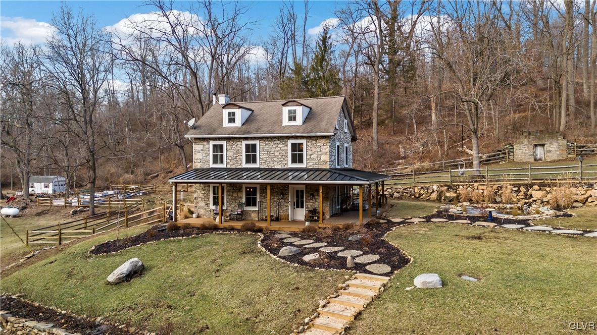90 Crow Hill Road Barto, PA 19504 - Photo 3 of 41 a front view of a house with swimming pool and trees
