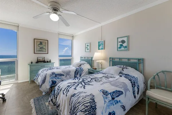 a bed room with bed and a window