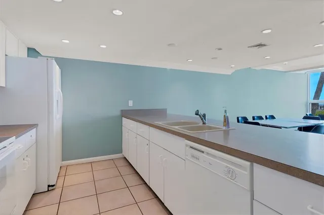 a view of a workspace with furniture and floor to ceiling window