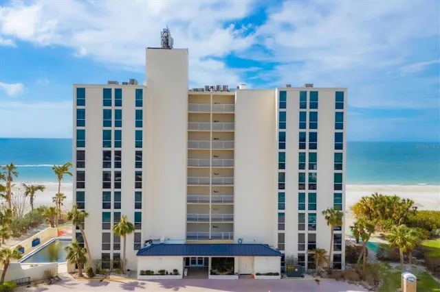 a building with potted plants in front of it