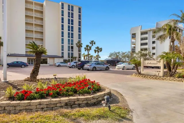 a front view of a building with a swimming pool