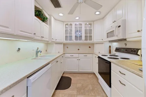 a room with a sink and cabinets