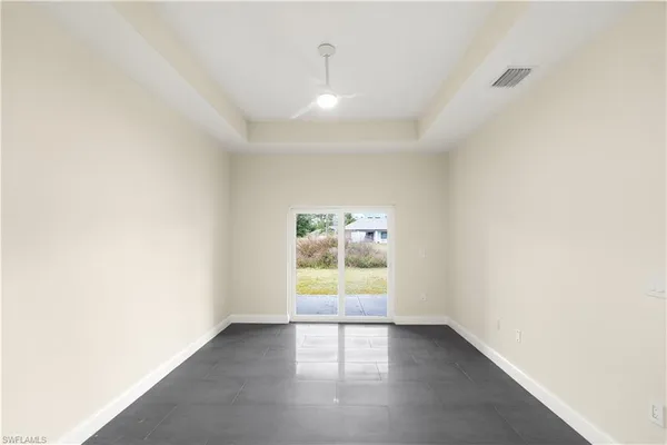 a bedroom with bed and window