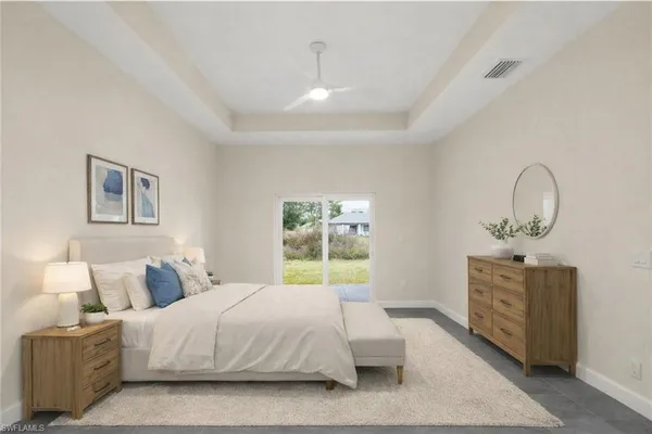 a bathroom with a granite countertop white toilet a sink and shower