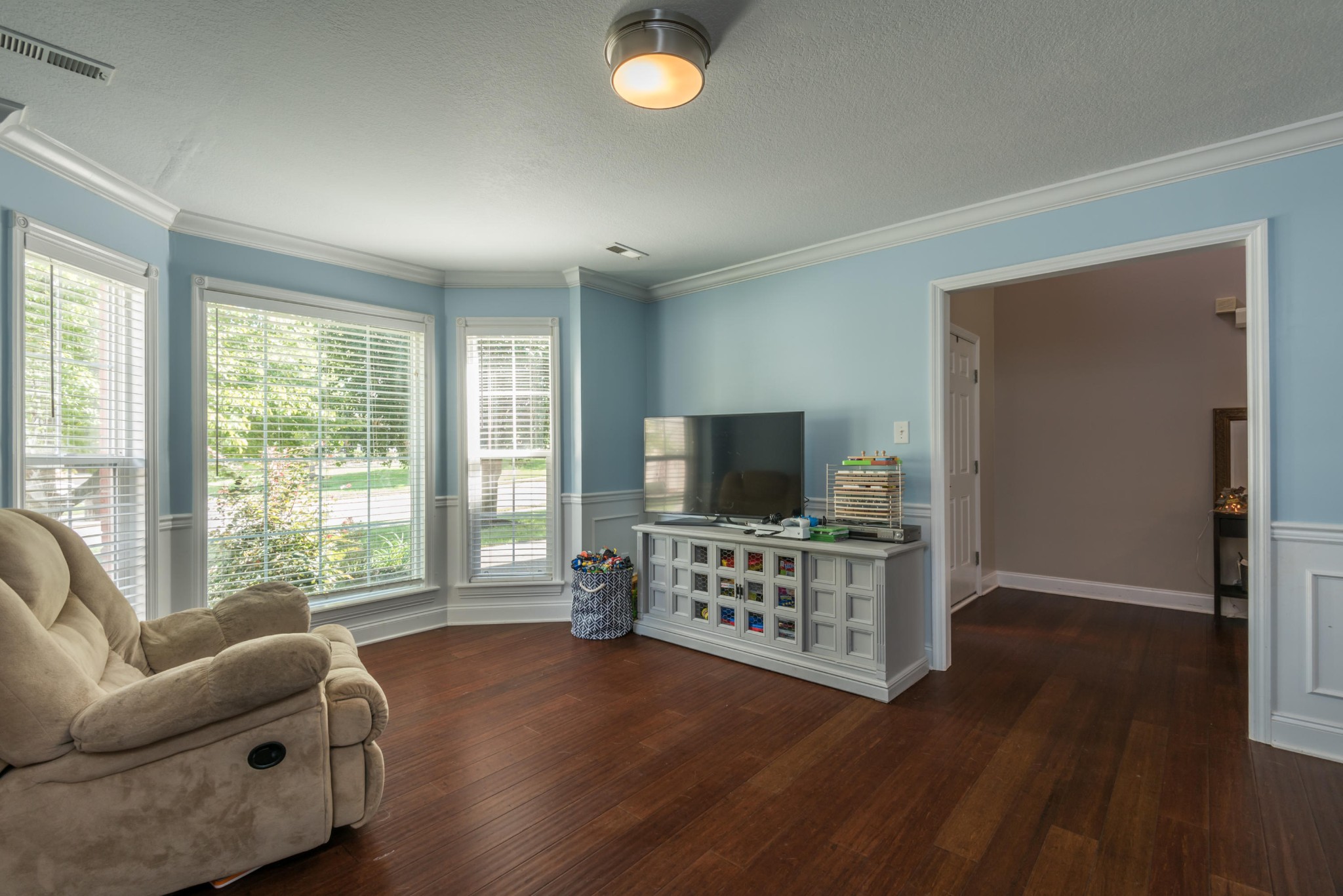 12665 Clear Ridge Road Knoxville, TN 37922 - Photo 11 of 39 a bedroom with furniture and a flat screen tv