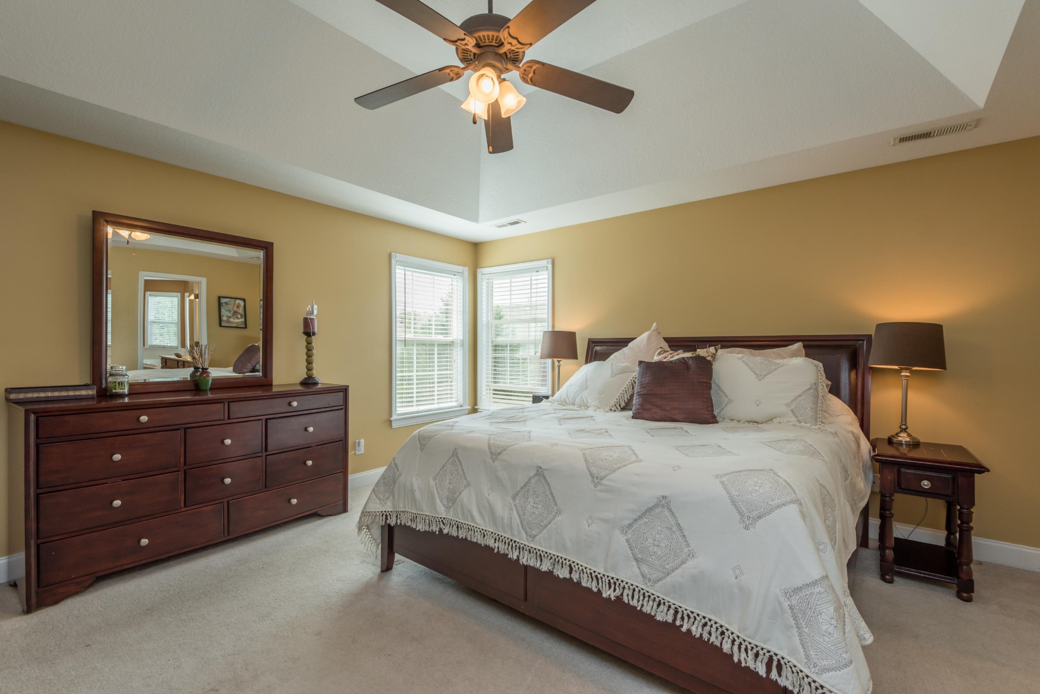 12665 Clear Ridge Road Knoxville, TN 37922 - Photo 26 of 39 a bedroom with a bed and a mirror on dresser