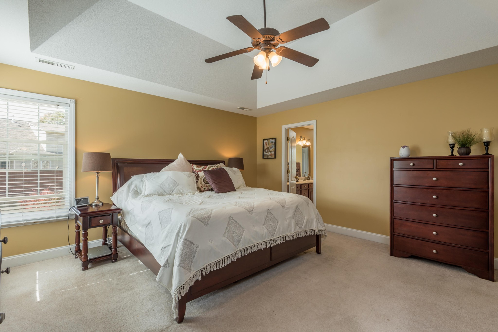 12665 Clear Ridge Road Knoxville, TN 37922 - Photo 27 of 39 a spacious bedroom with a bed and a chandelier