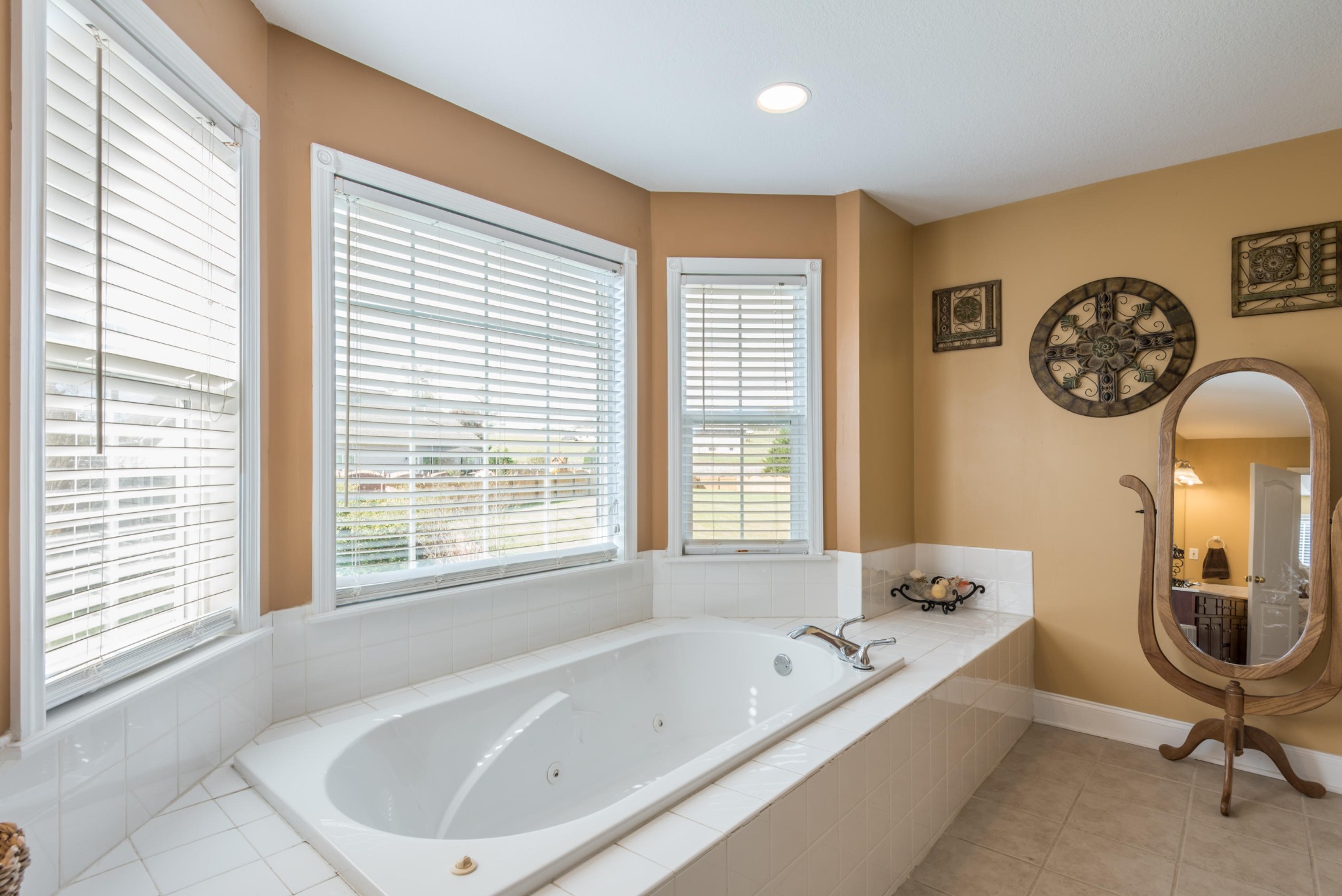 12665 Clear Ridge Road Knoxville, TN 37922 - Photo 29 of 39 a bathroom with a large tub and a window