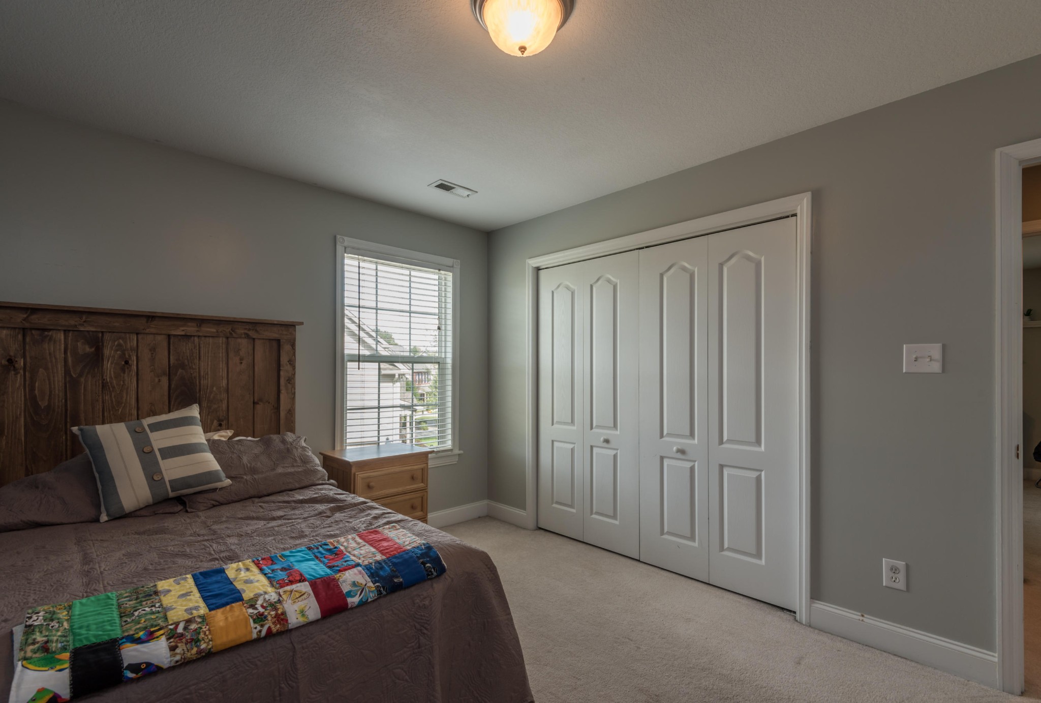 12665 Clear Ridge Road Knoxville, TN 37922 - Photo 32 of 39 a bedroom with a bed and a window