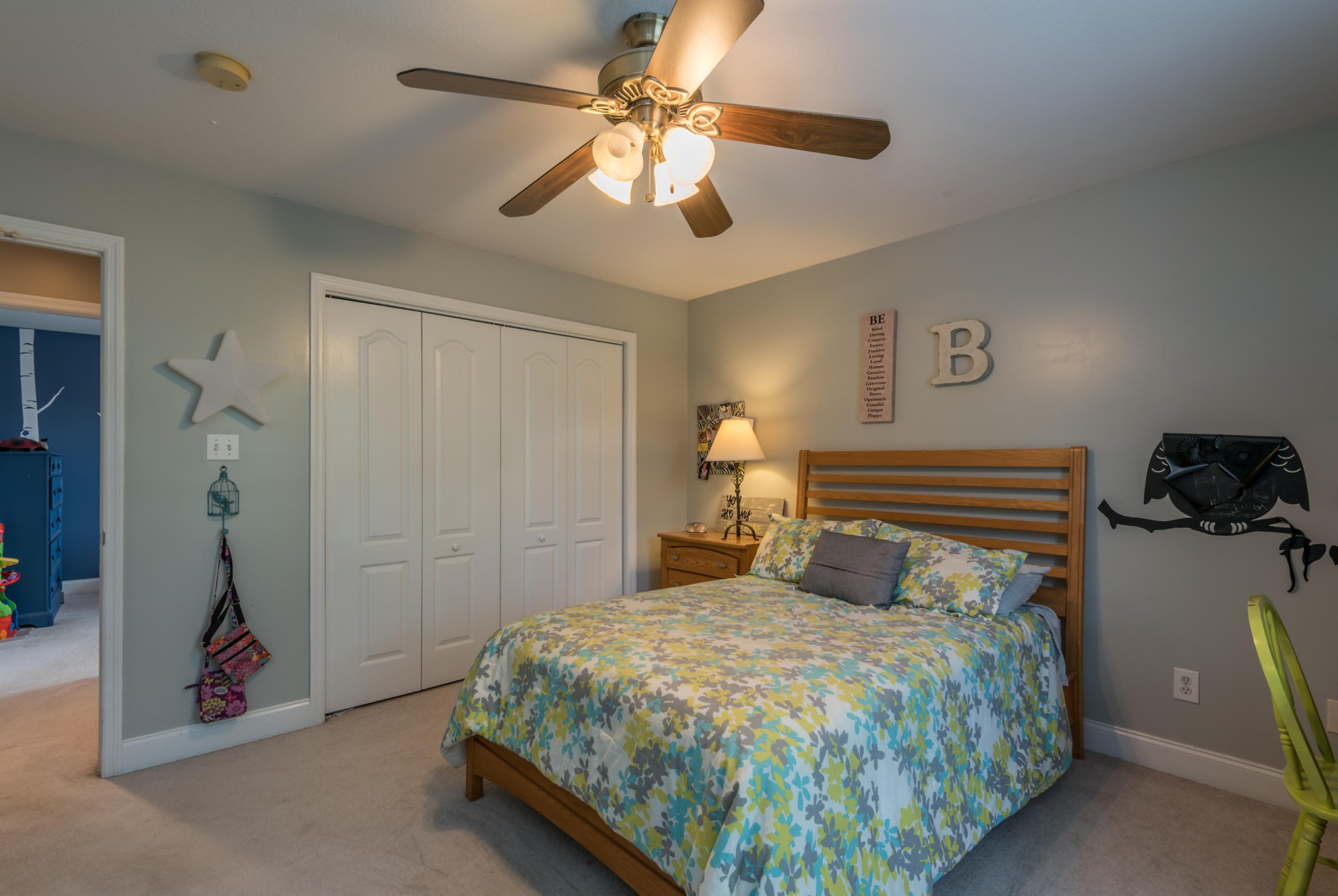 12665 Clear Ridge Road Knoxville, TN 37922 - Photo 34 of 39 a bedroom with a bed and a chandelier