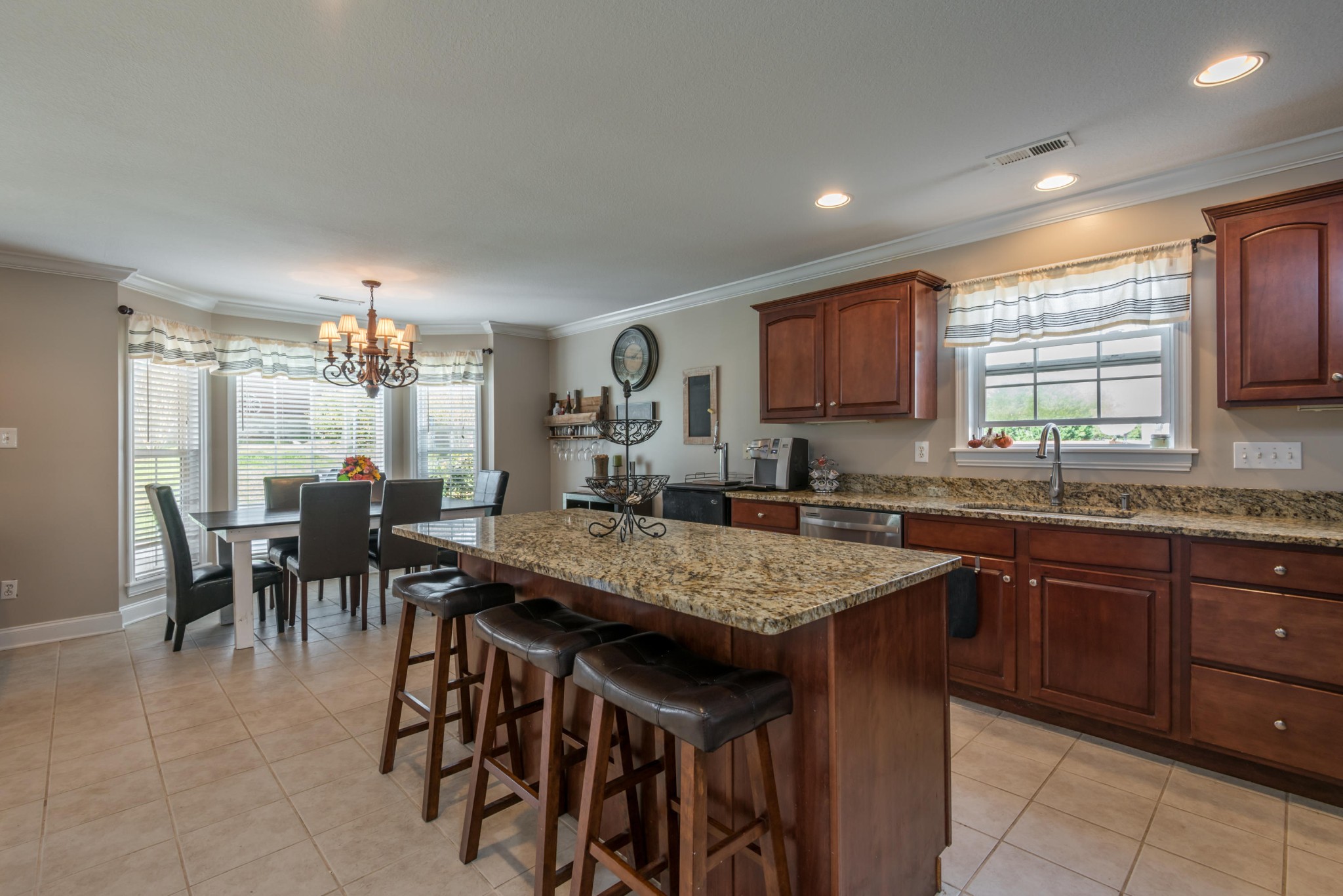 12665 Clear Ridge Road Knoxville, TN 37922 - Photo 7 of 39 a kitchen with granite countertop a sink table and chairs
