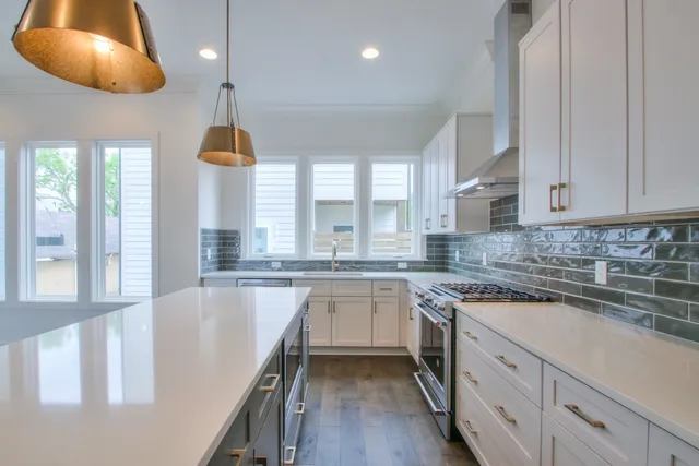 a kitchen with a sink cabinets and window